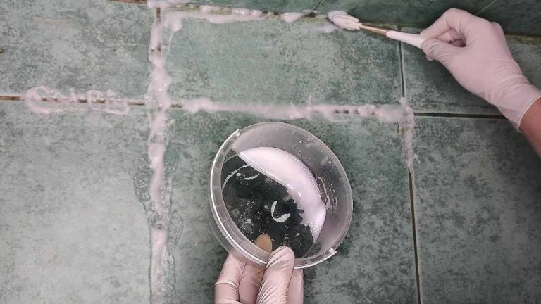 This natural compound will make black grout between tiles white again